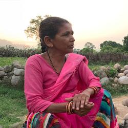 Researcher interviewing a local woman in India
