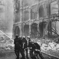 Firefighters putting out a blaze in London after an air raid during The Blitz in 1941.