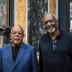 Artist Kerry James Marshall and Henry Louis 'Skip' Gates Jr stand in front of the donated portrait