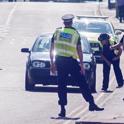 Police stopping traffic in UK lockdown