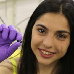 PhD student Maria Kiourlappou holding a piece of SmB6