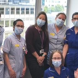 Estee Torok (centre, in black) with team at Addenbrooke's Hospital