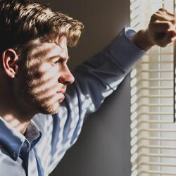 Man looking out of window