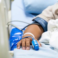 Male patient in a hospital bed