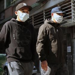 Men in masks, Macau, PRC