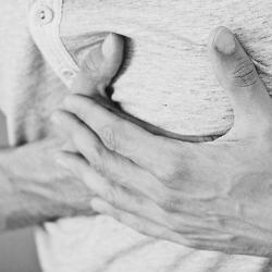 Man clutching his heart