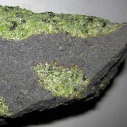 Chunks of exotic green rocks from the mantle erupted from the San Carlos Volcanic Field, Arizona