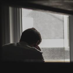 Man looking out of window