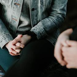 Close up of hands of two people talking