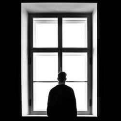 Man standing in front of window