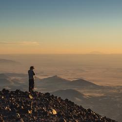 Man in a cowboy hat atop Humphreys Peak in Arizona, US