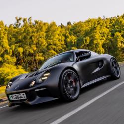 The Nyobolt EV sportscar driving along a road.