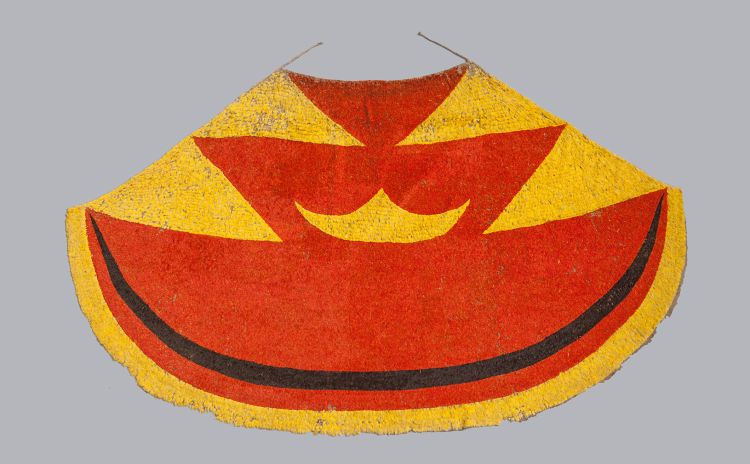 A red, yellow and black feather cloak