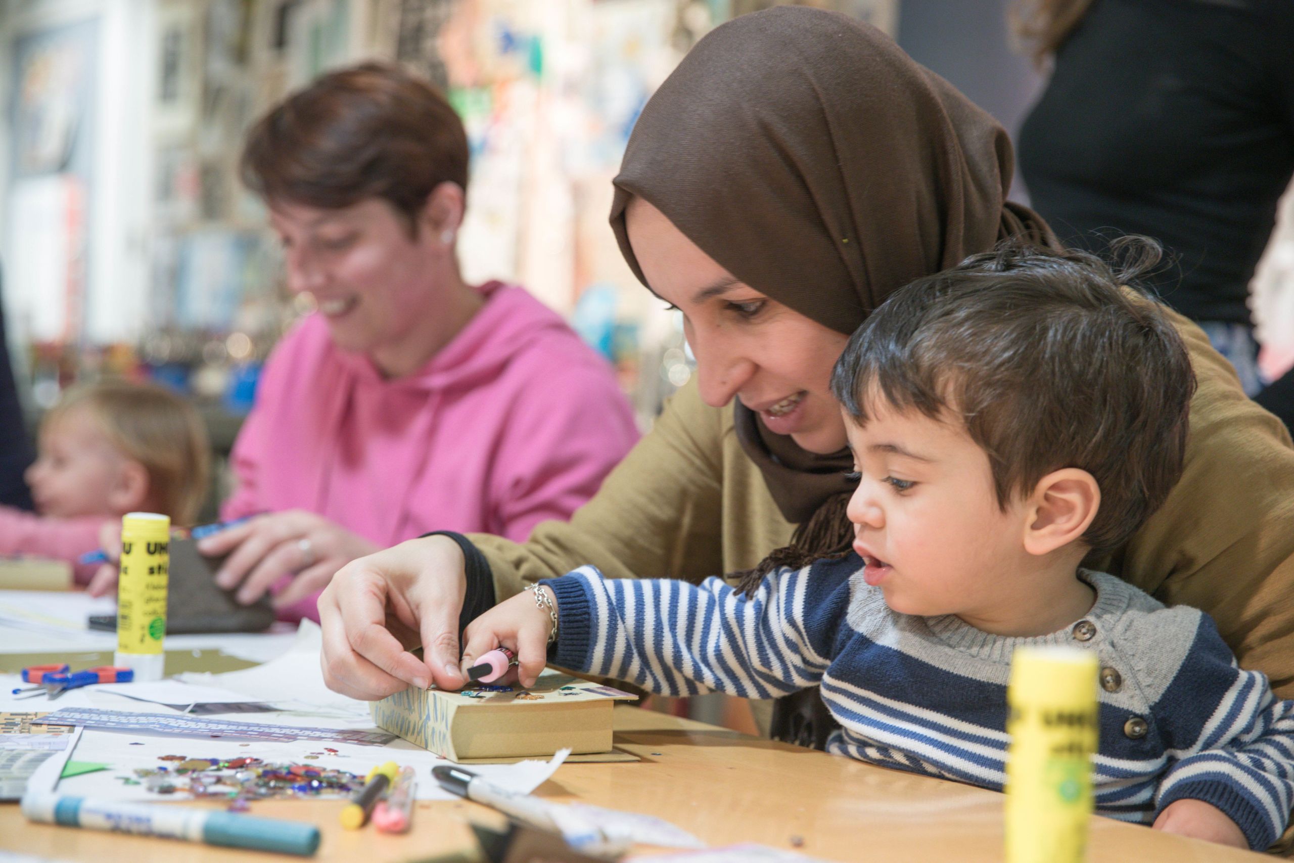 Woman helping child