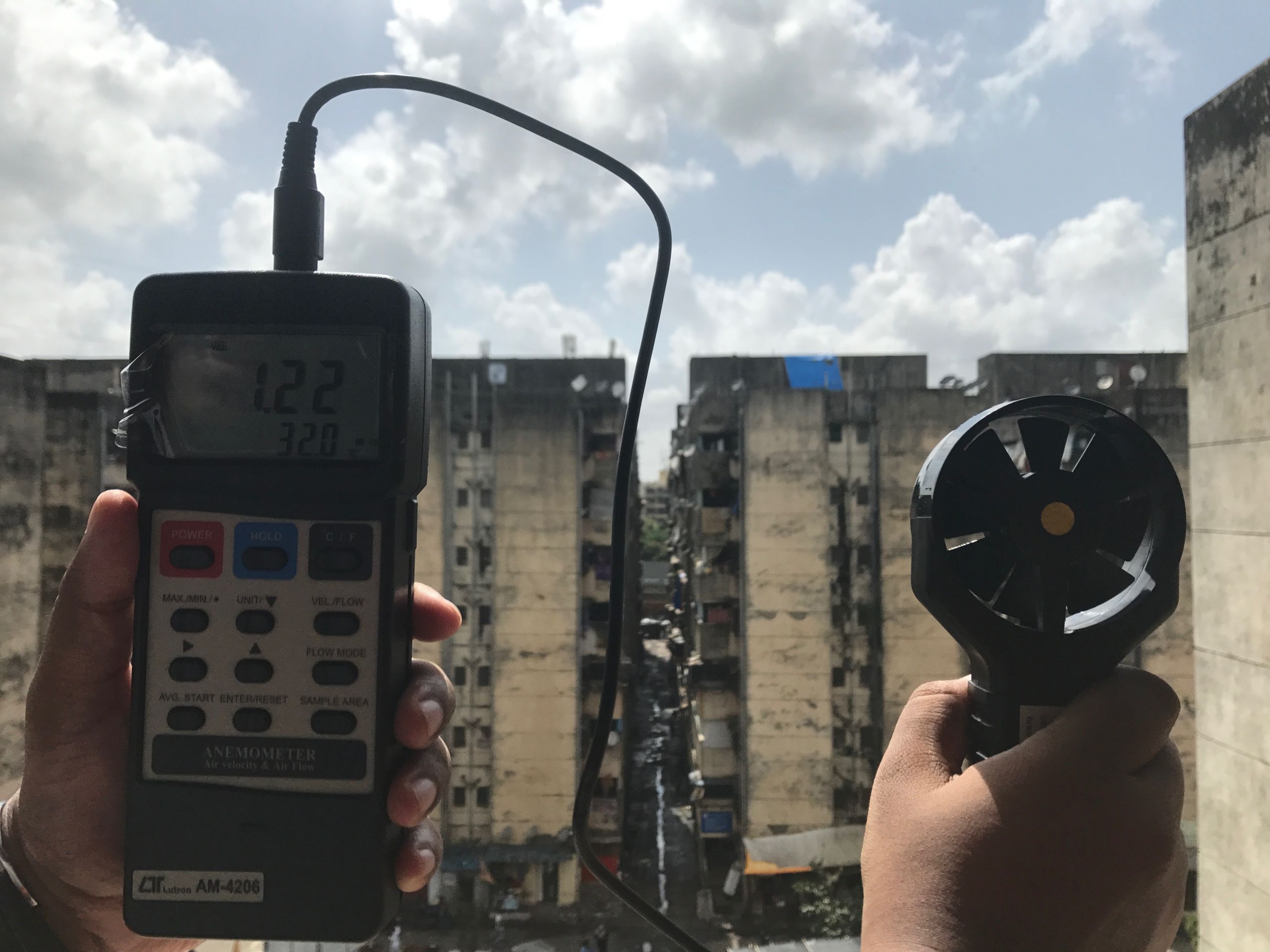 Ronita Bardhan measuring air flow outside an SHR apartment in Mumbai (2017). Courtesy of Ronita Bardhan