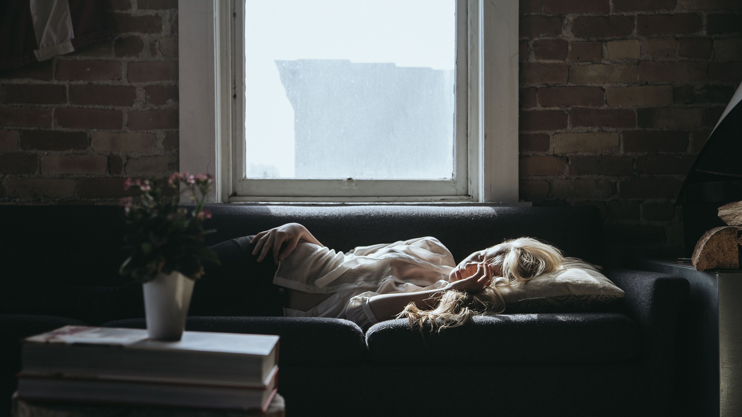 Tired woman on sofa