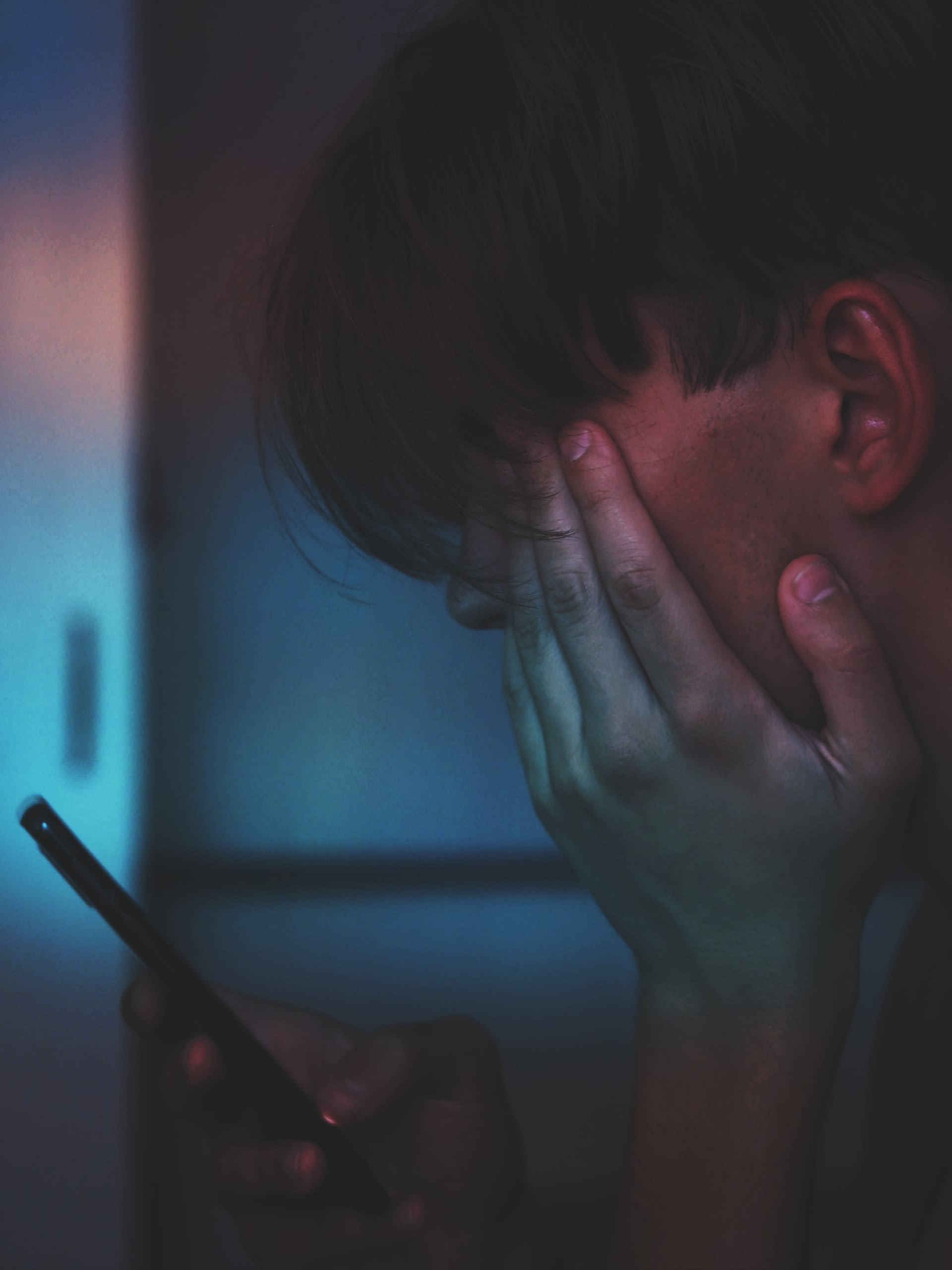 Teenager using a smartphone