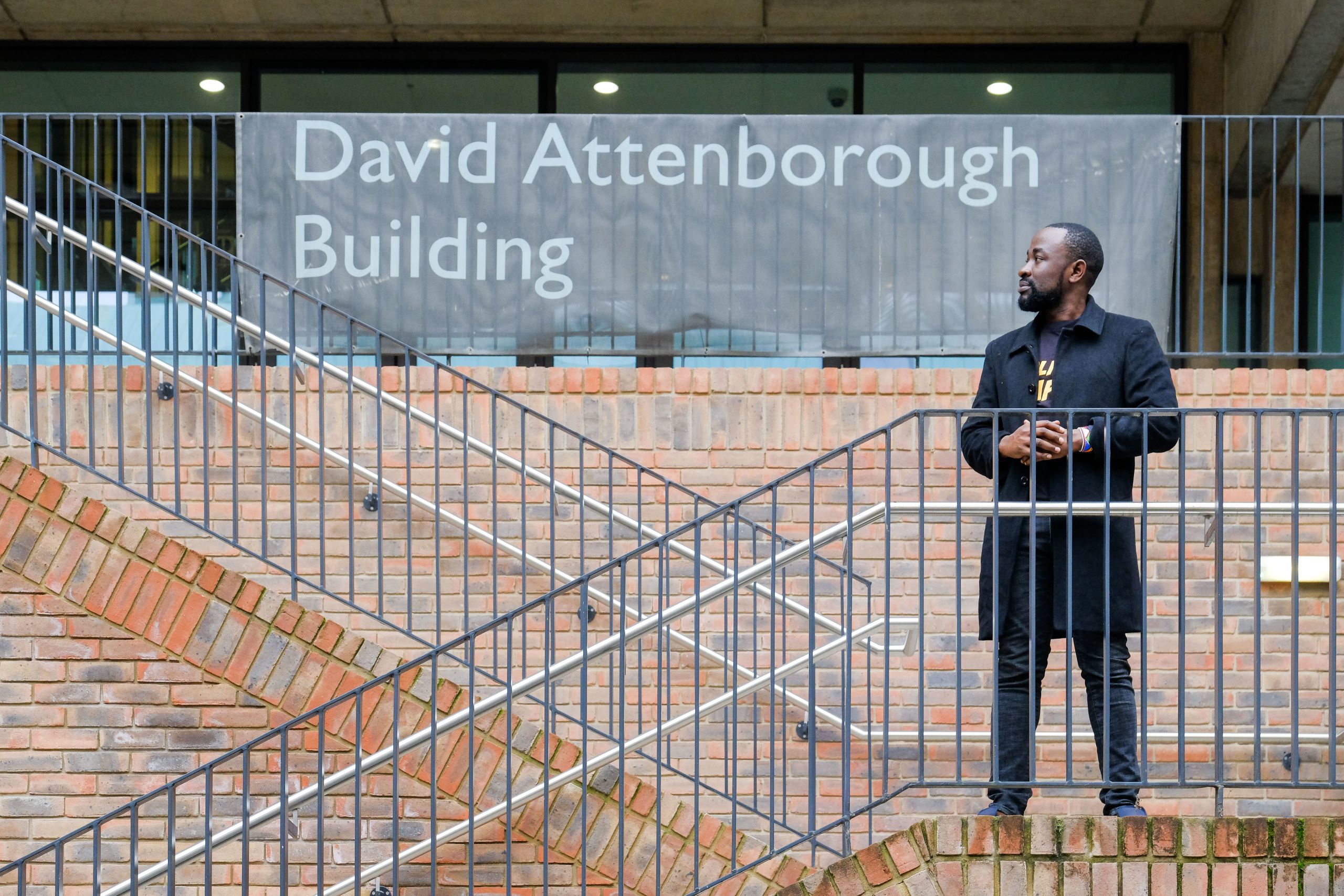 Nyandire Reinhard standing outside the David Attenborough Building