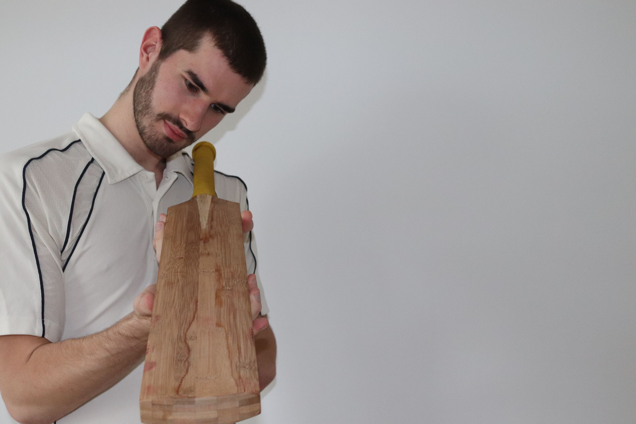 Ben Tinkler-Davies with the prototype bamboo bat