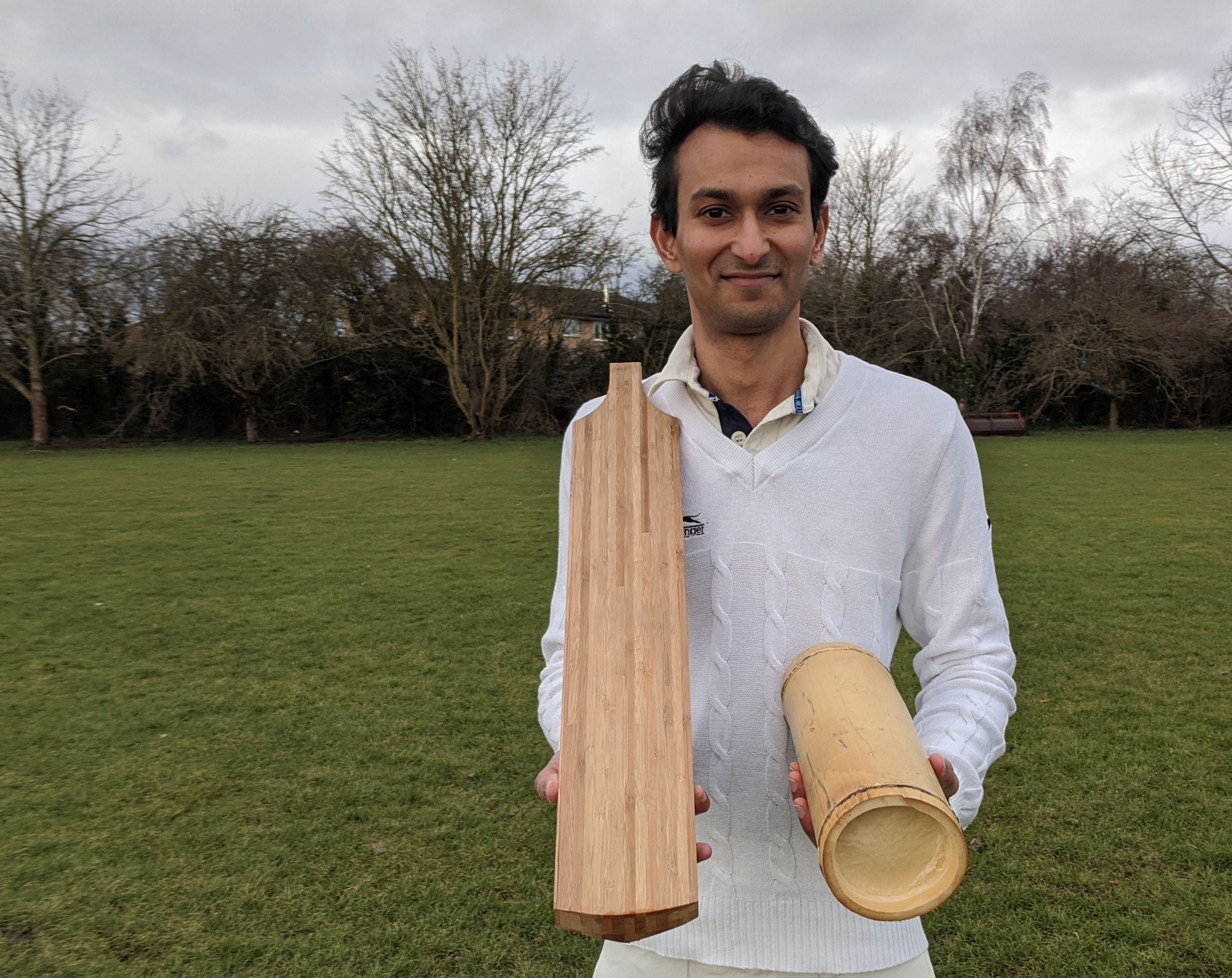 Dr Darshil Shah with the prototype bat and a section of bamboo culm