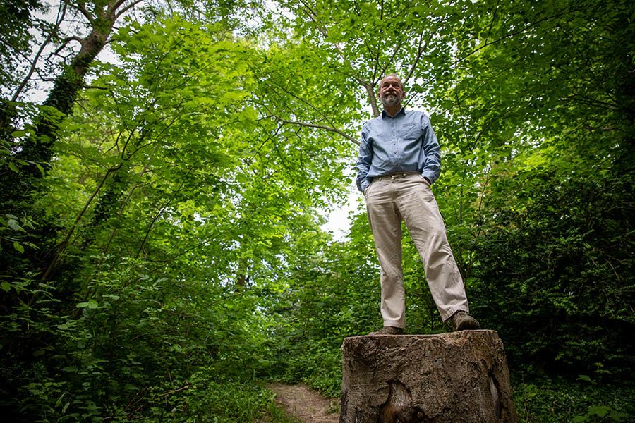 Bill standing on tree stump