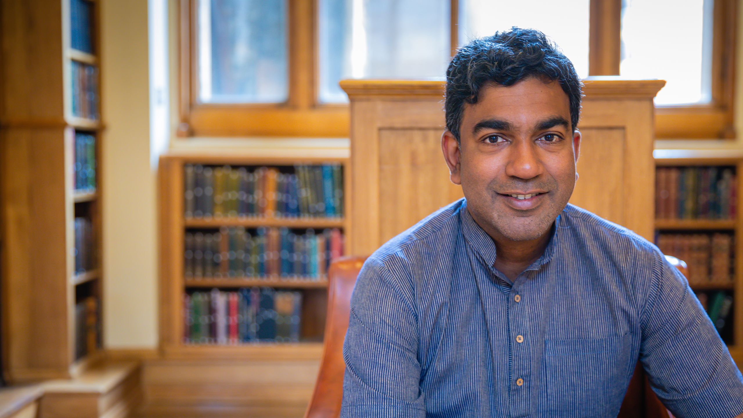 Sujit Sivasundaram in the Old Library, Caius.