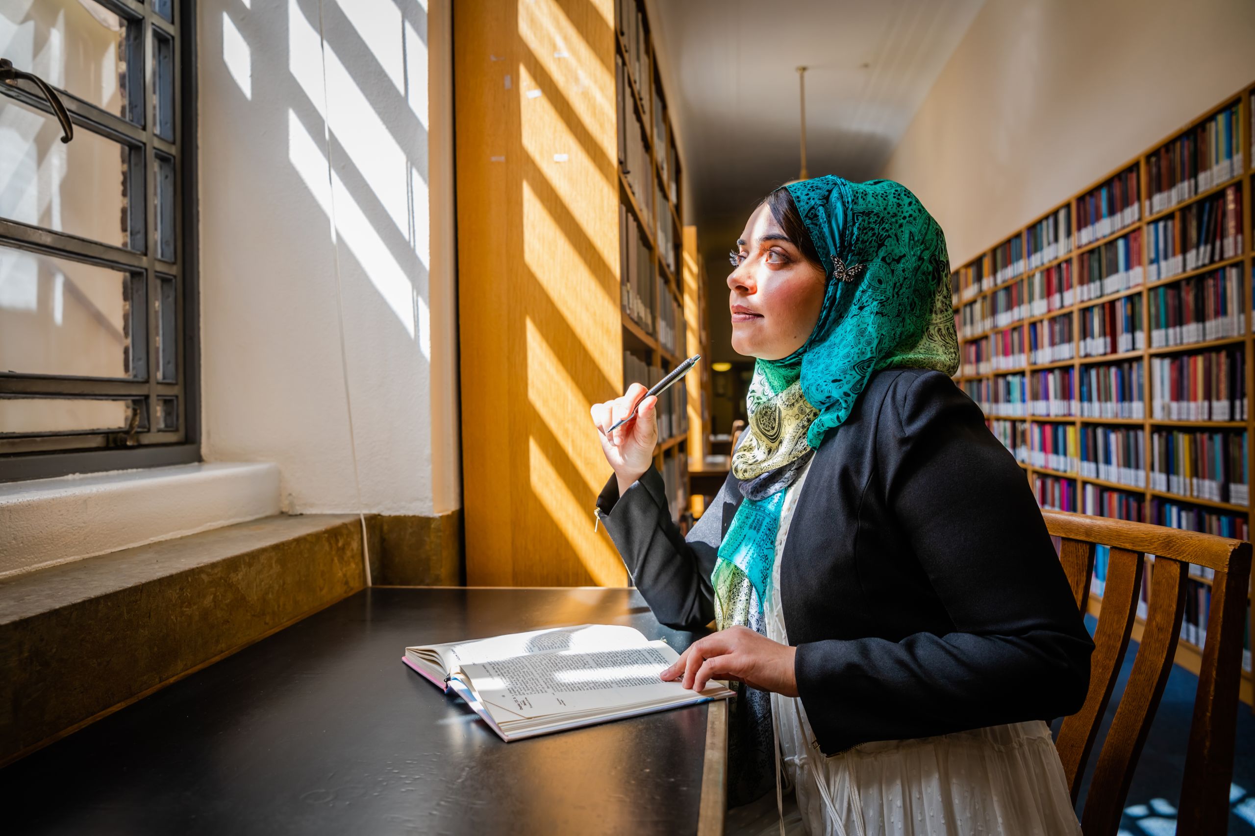 Rihab studying in the University Library