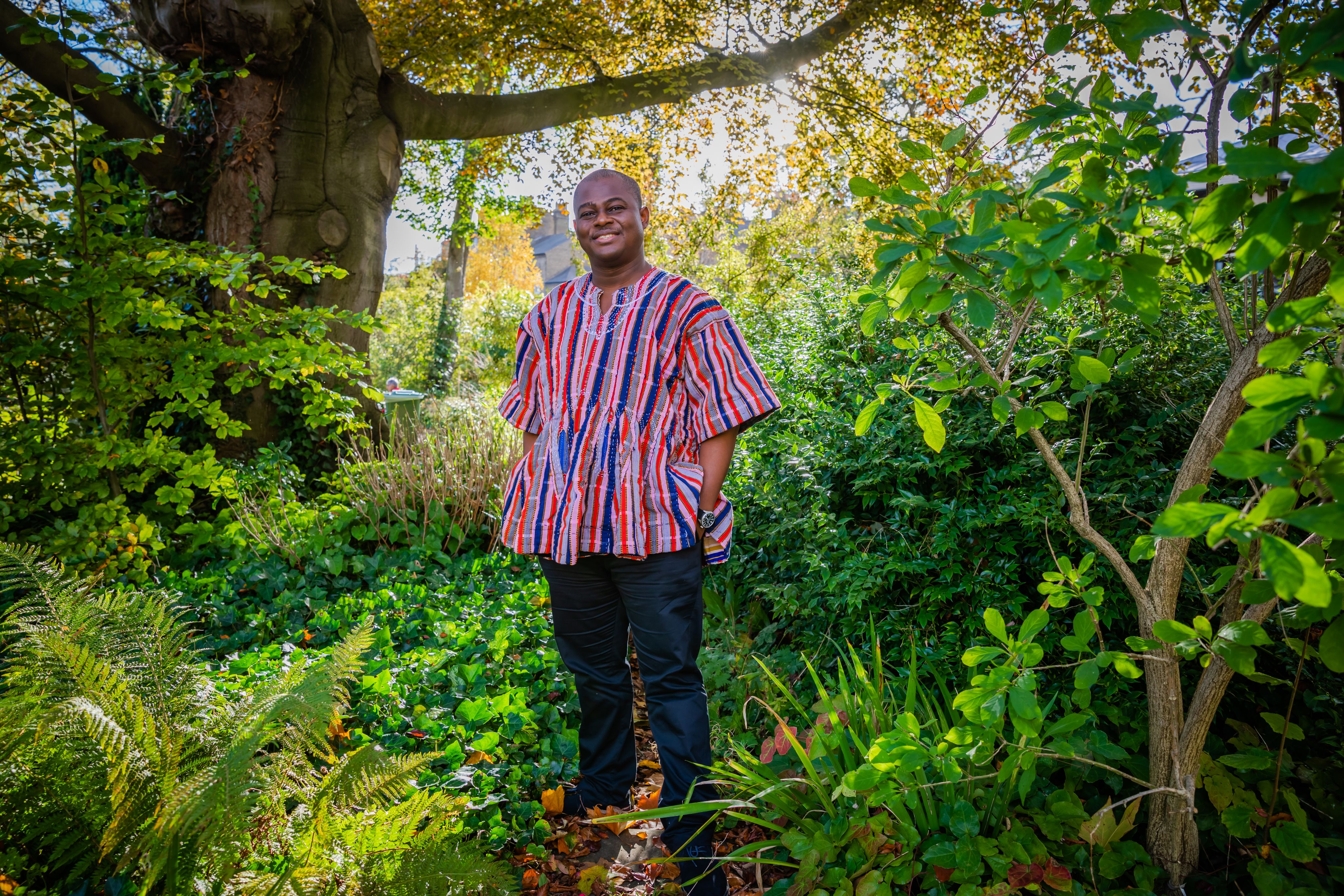 Kwabena Kusi-Mensah in the gardens at Darwin College