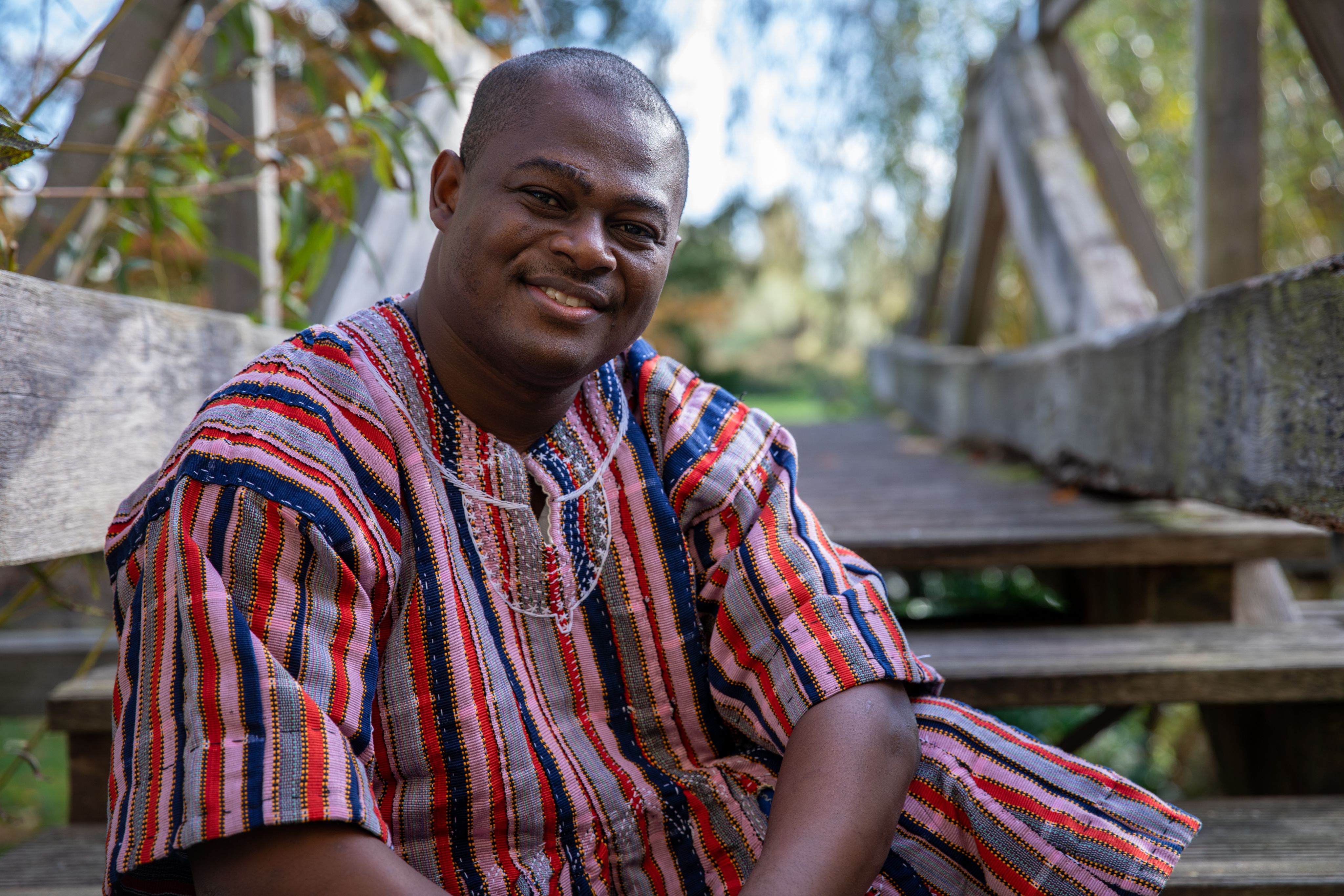 Kwabena Kusi-Mensah in the gardens at Darwin College