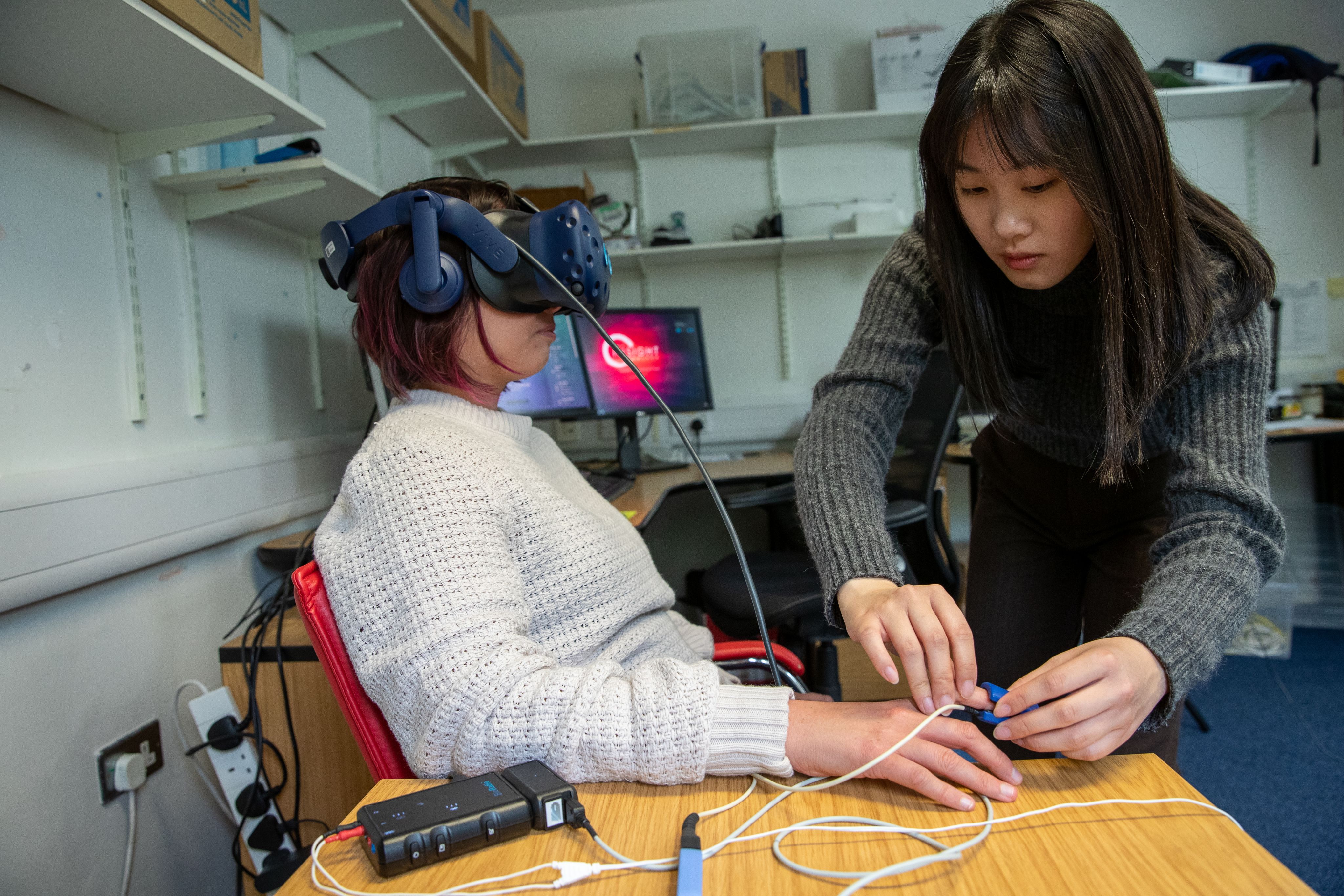 Lucie Daniel-Watanbe tests the VR, assisted by Grace Leung