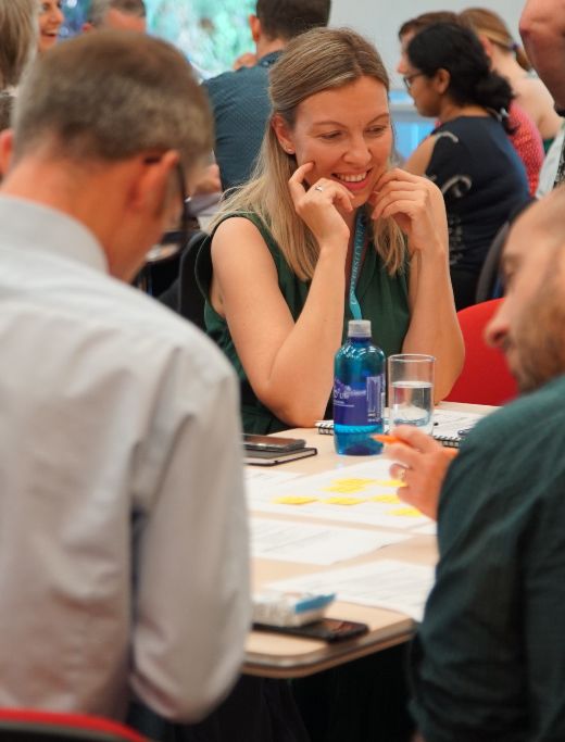 Staff talking together at a workshop