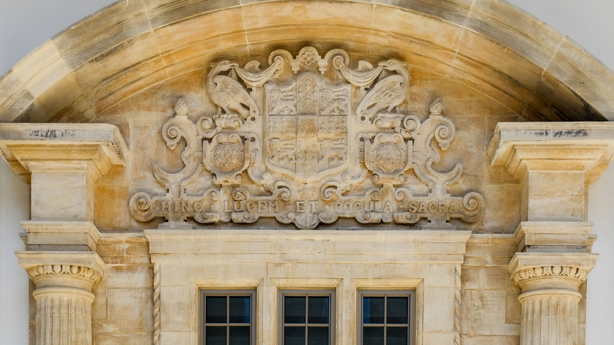 A photo of the University Crest on a University building