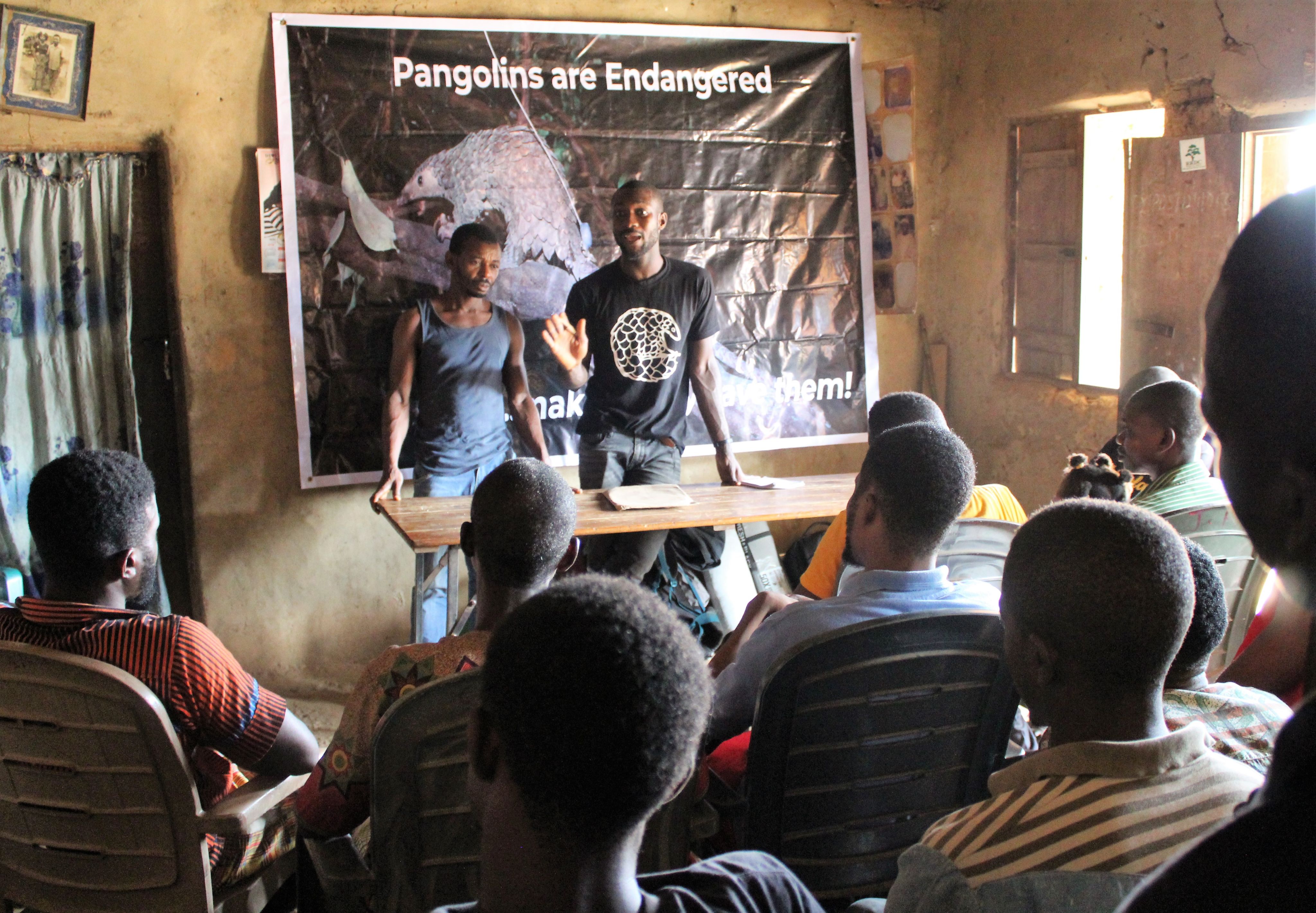 Charles speaking to Pangolin hunters in Nigeria.