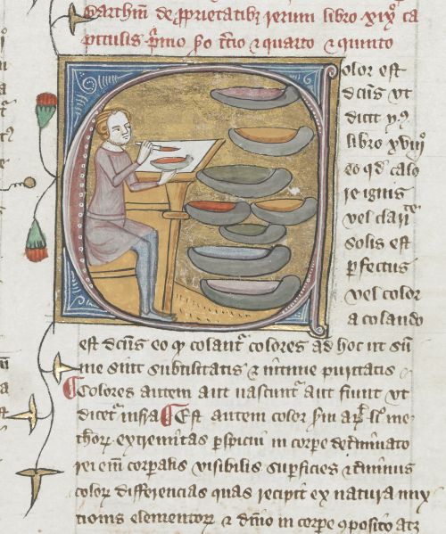 An illustration from a manuscript. Shows a man mixing paint colours. The background is gold.