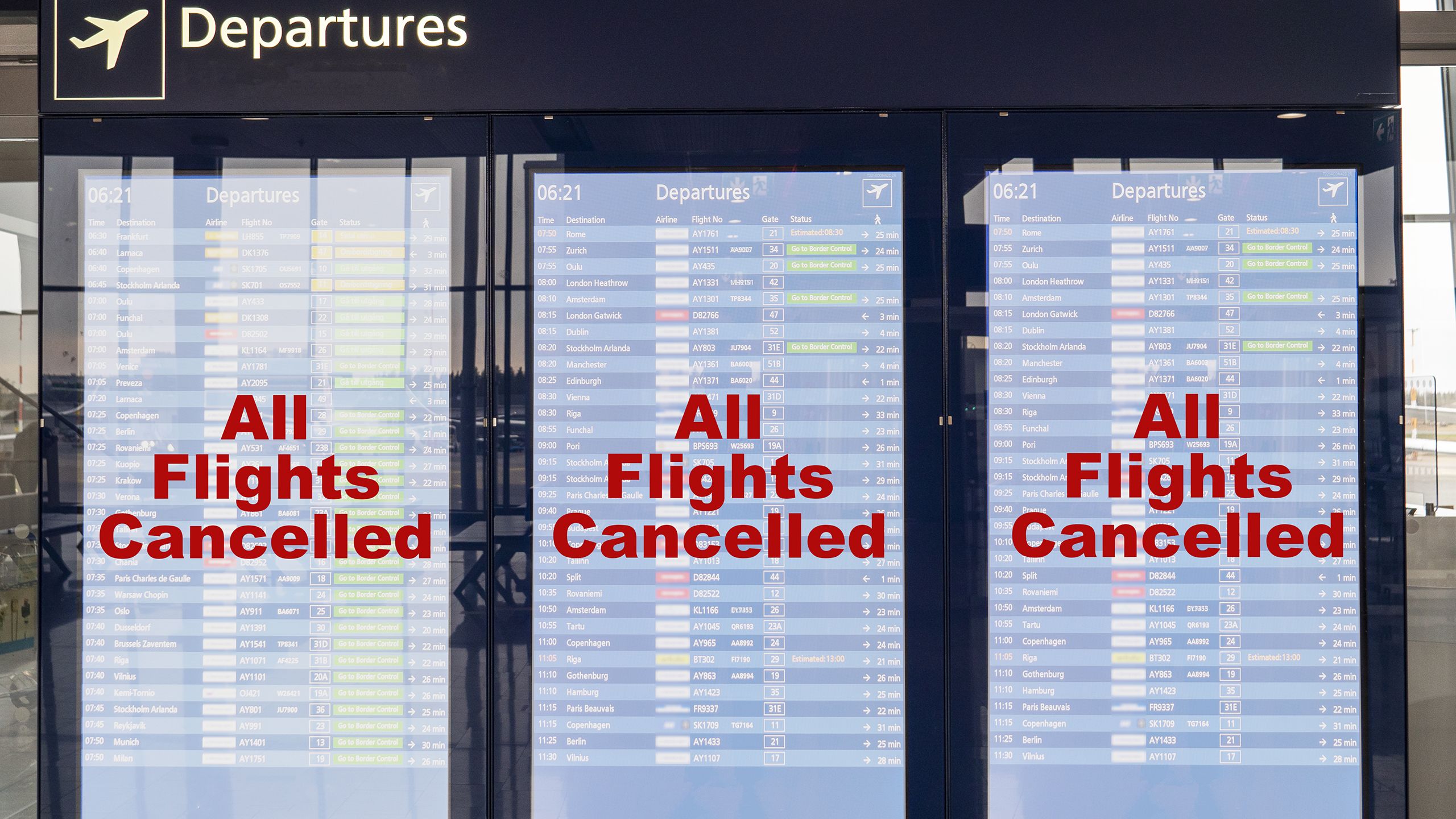 Airport departure boards showing all flights cancelled