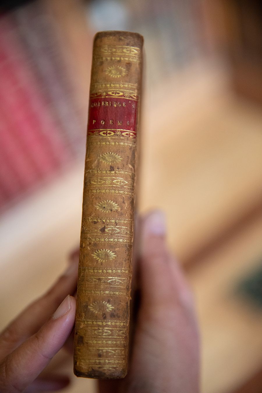 Mathelinda holding book of Coleridge’s poetry