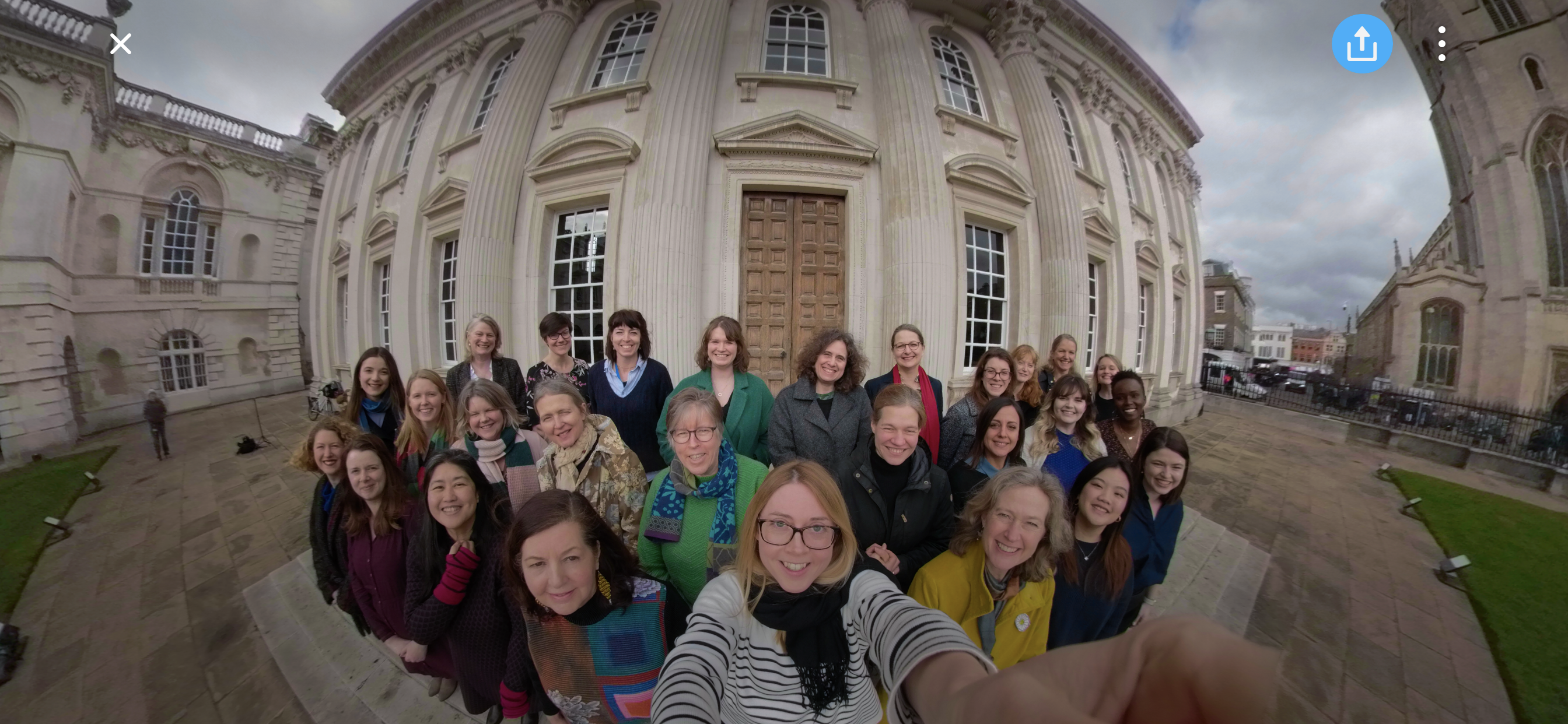 Women of Cambridge University gather on the steps of Senate House
