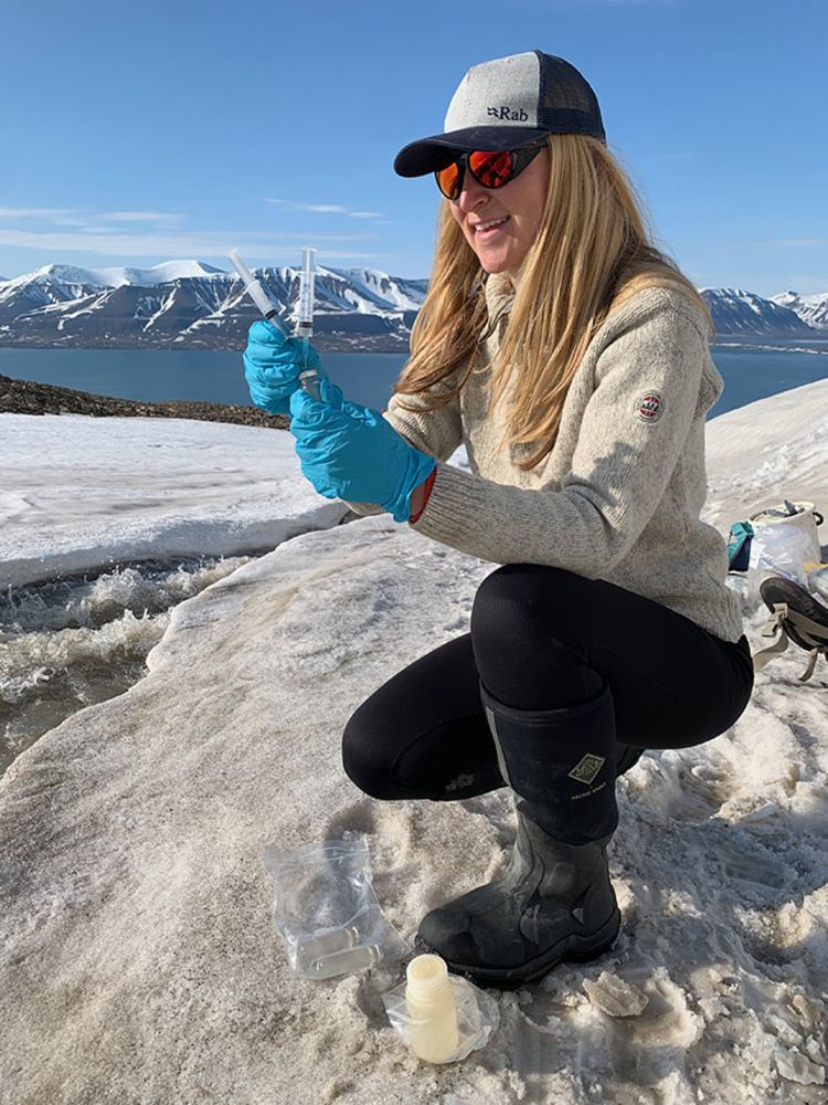 Gabrielle Kleber taking water samples