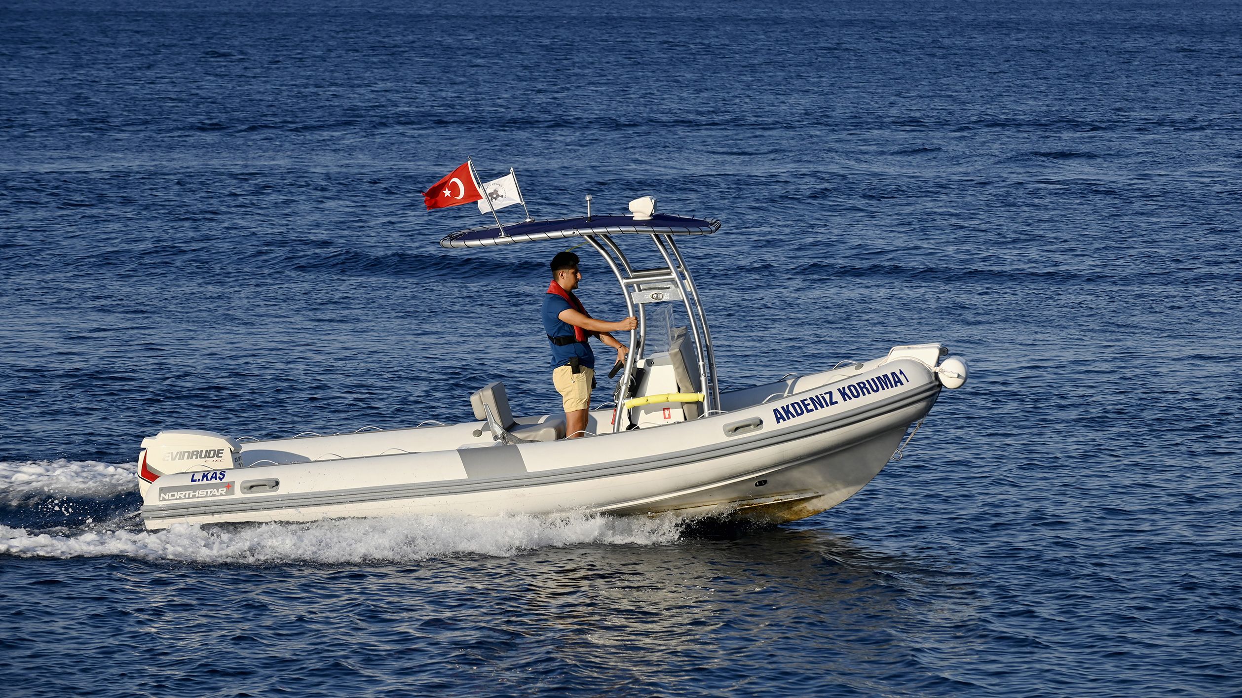 Marine ranger enforces no-fishing zone near Kas, Türkiye.