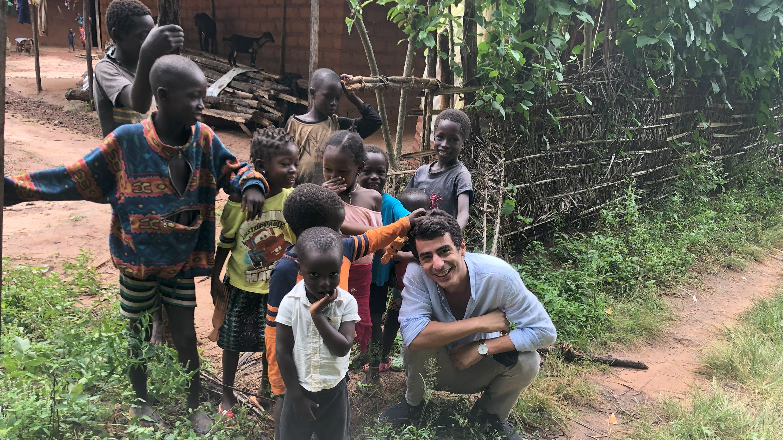 Joao Costa with children in Guinea Bissau.