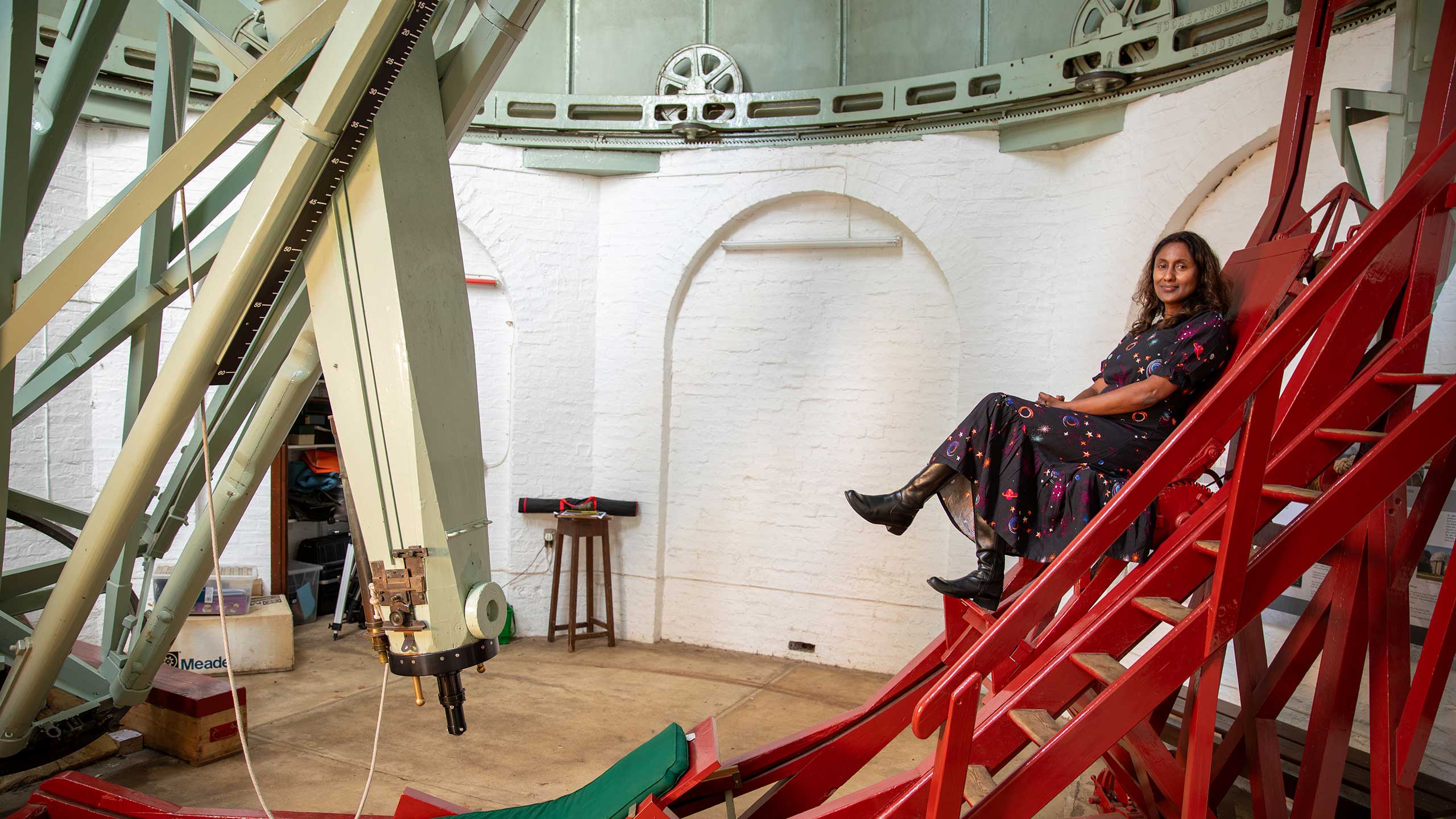 Professor Hiranya Peiris with the Northumberland Telescope at the Institute of Astronomy.