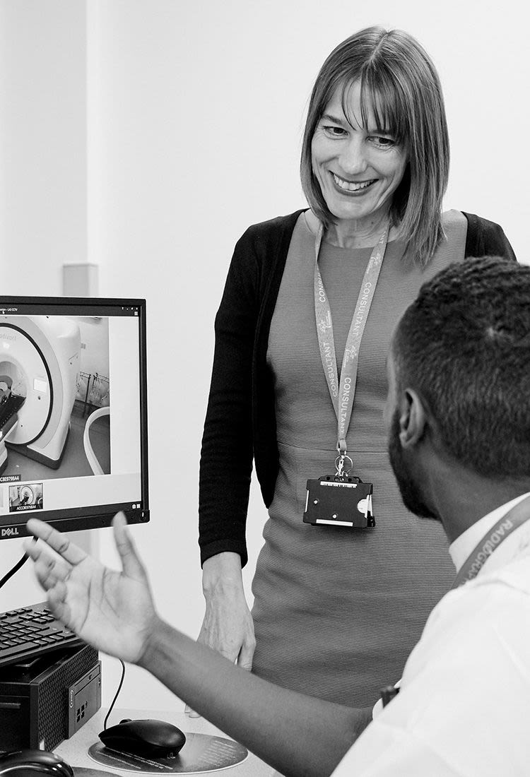 Professor Charlotte Coles talking to a colleague