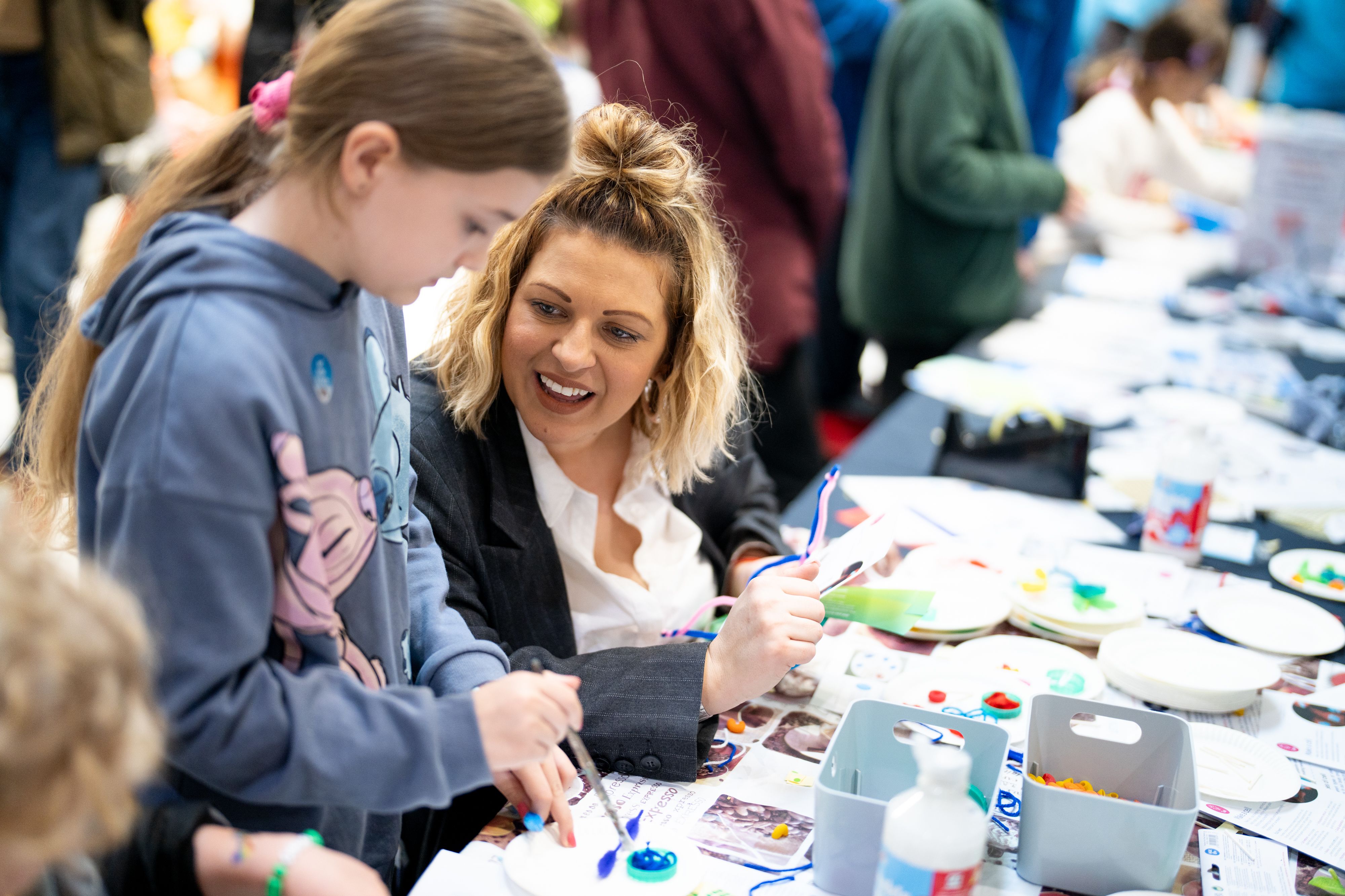 a researcher engages with the public during the festival family weekend