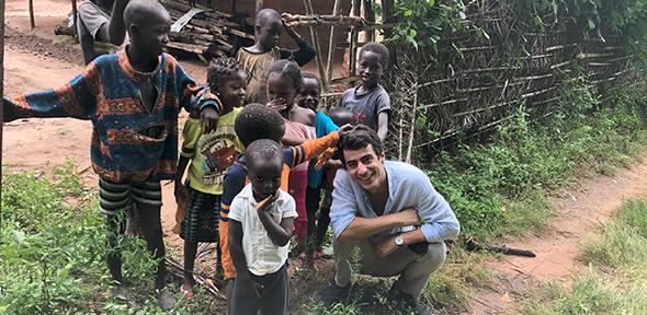 Joao Costa surrounded by children in Guinea-Bissau