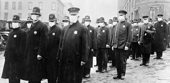 Policemen in Seattle wearing masks made by the Red Cross, during the Spanish Influenza epidemic, December 1918. 