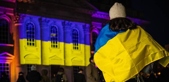 A participant at the University's vigil for Ukraine earlier this year. 