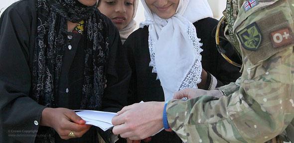 A British army sergeant visits a school in Helmand, Afghanistan.