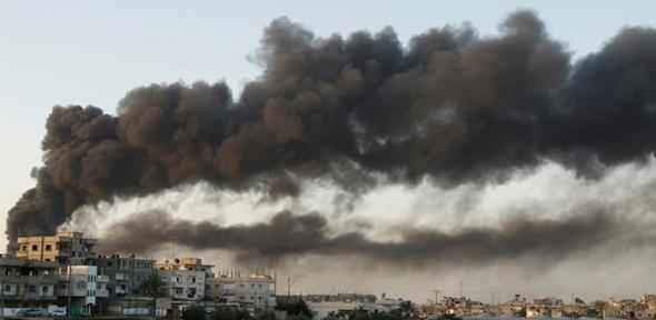 Smoke rises after an Israel air strike in Gaza Strip December 28, 2008.