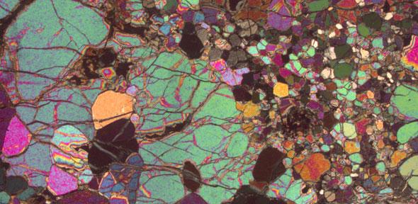 Thin section of igneous rock photographed under a polarising microscope