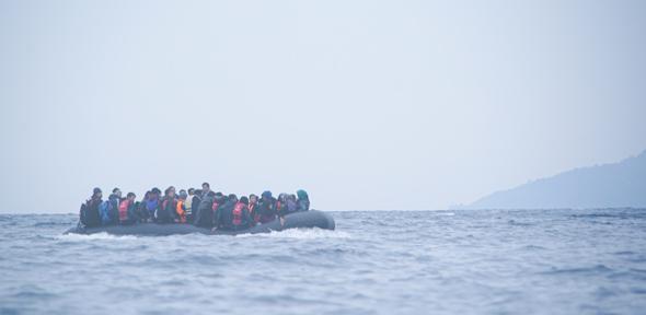 Refugees on a boat crossing the Mediterranean sea, heading from Turkish coast to the northeastern Greek island of Lesbos, 29 January 2016